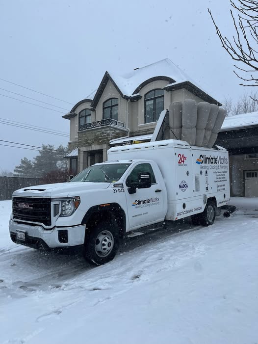 Climate Works duct cleaning truck on a snowy Ottawa driveway during a service call
